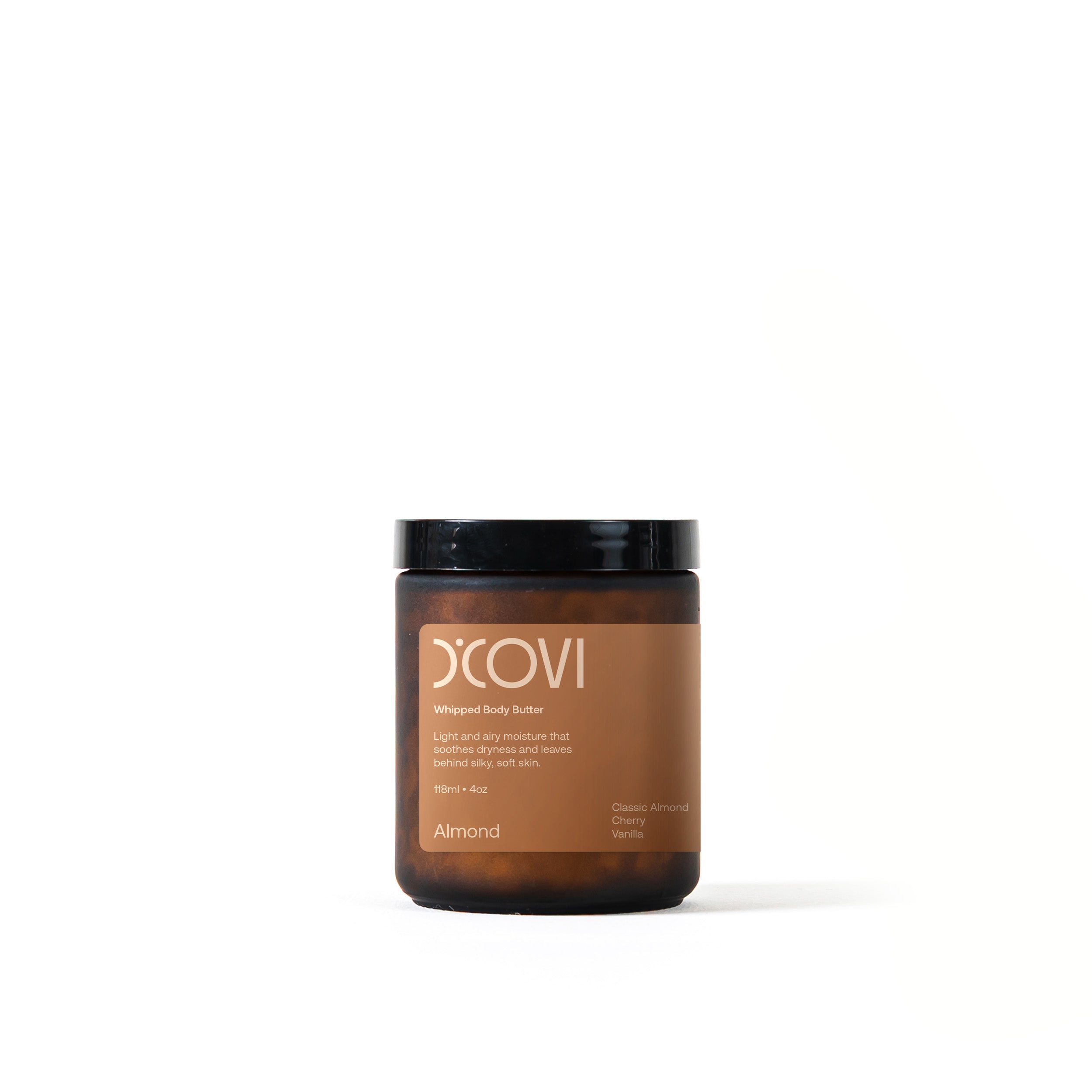 D’Covi glass jar with black lid and cream label containing 118ml (4oz) of whipped body butter, scent, “Almond”.