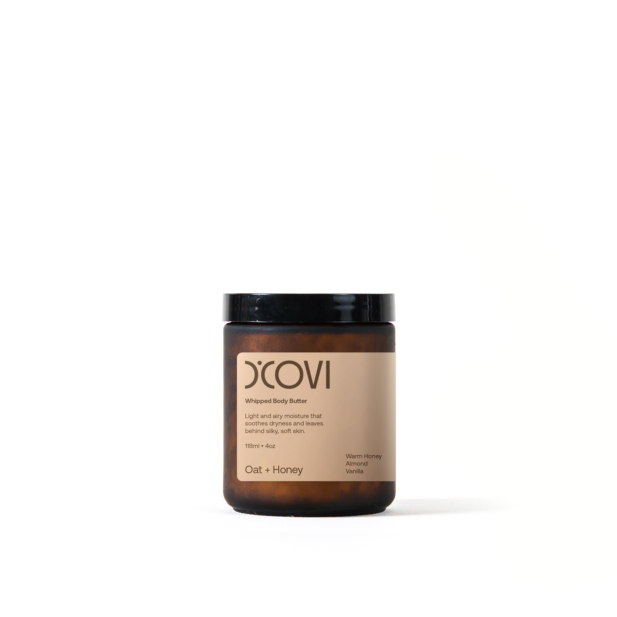 D’Covi glass jar with black lid and cream label containing 118ml (4oz) of whipped body butter, scent, “Oat and Honey”.