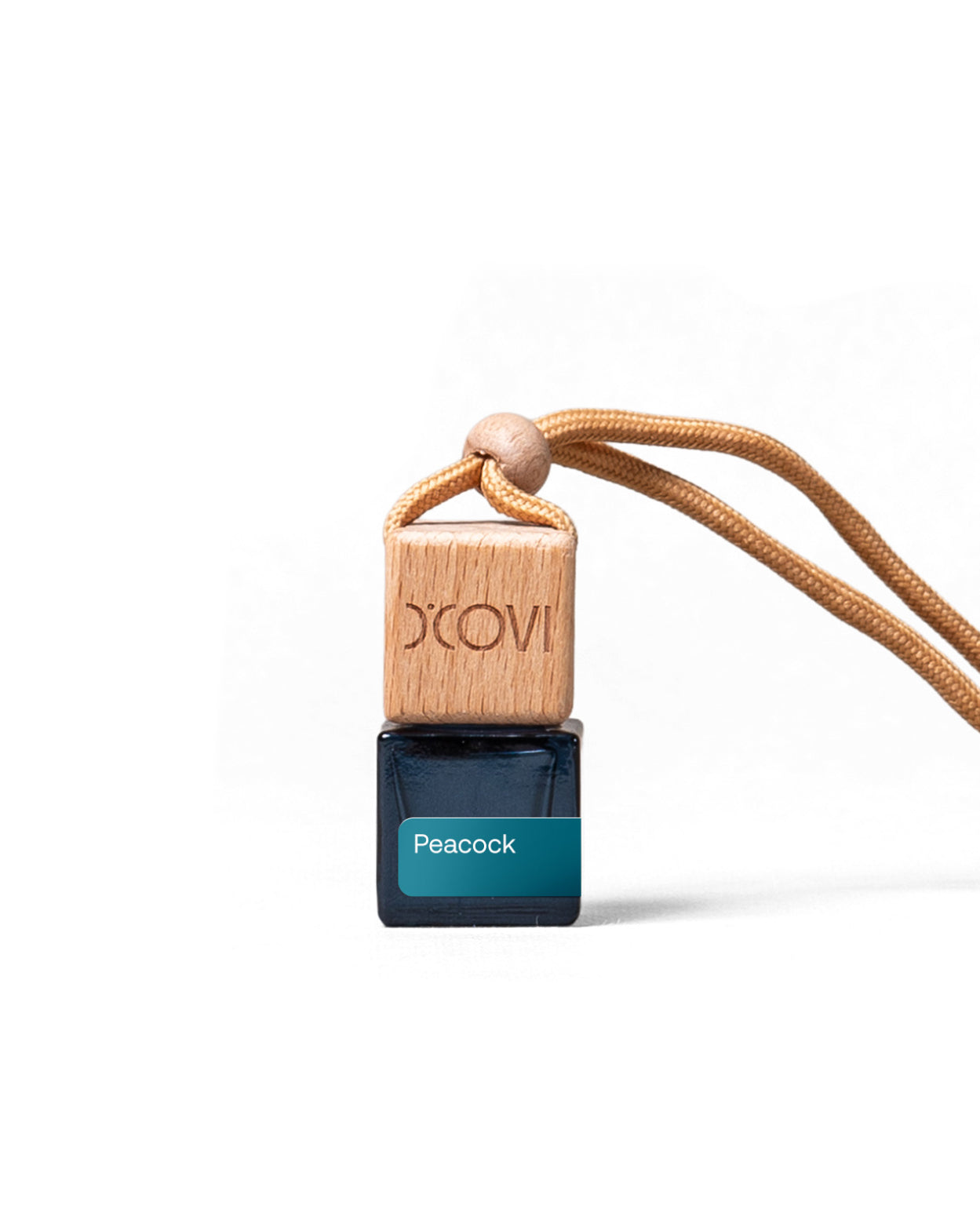 Small D'Covi Diffuser bottle labeled 'Peacock' with a teal label and wooden cap on a white background