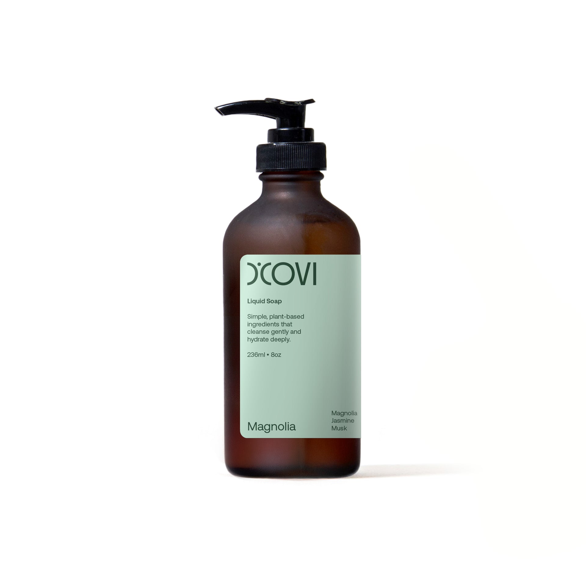 D'Covi amber glass bottle with black pump and sage green label on a white background. Containing 236ml (8oz) Magnolia liquid soap.