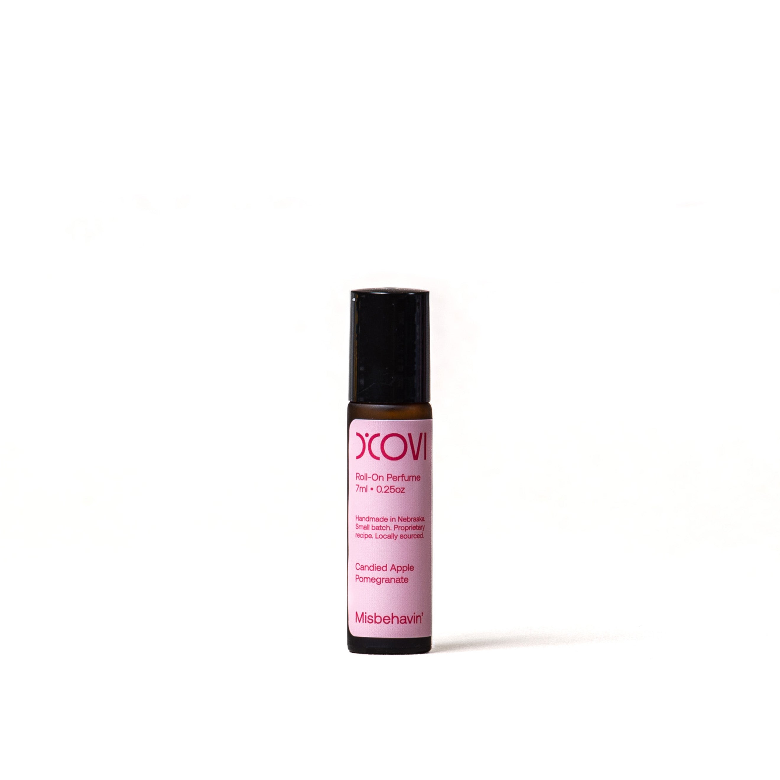 D’Covi glass roll on perfume with black lid and light pink label containing 7ml (.25oz) of Misbehavin' Perfume